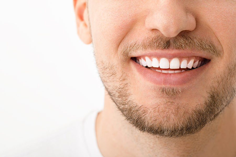 A Beautiful Man Is Smiling. A Smile With White Teeth. Close Up I