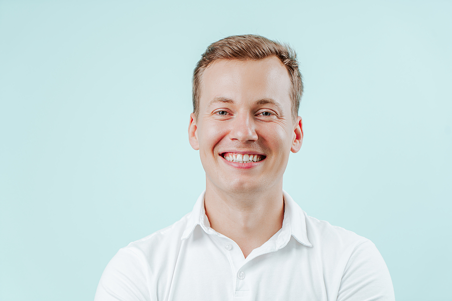 Young Man Smiling With Natural White Teeth In Dental Clinic On L Beautiful Results