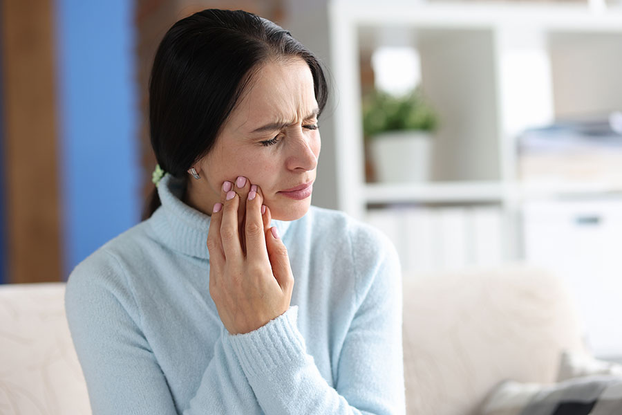 Young Woman With Severe Toothache At Home. Sudden Pain In Tooth