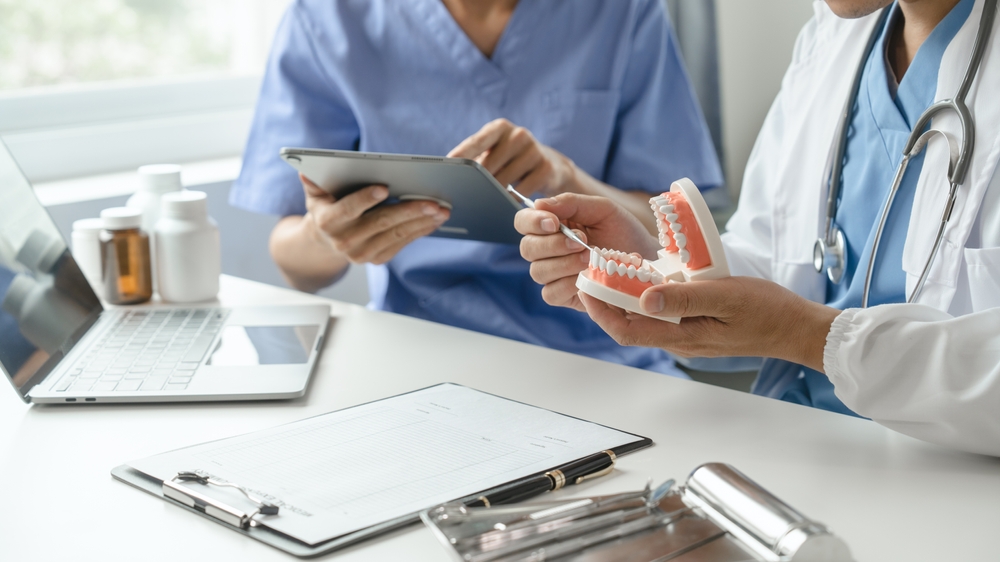 Team,Of,Doctors,And,Dentists,Talking,And,Working,Health,Care