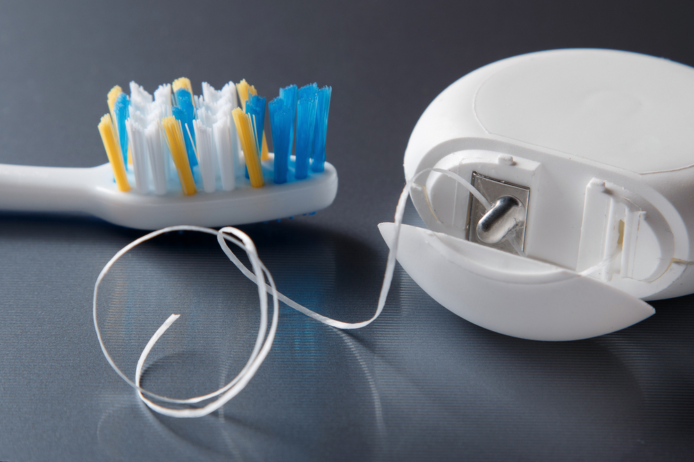 Close,Up,Of,Toothbrush,And,Dental,Floss